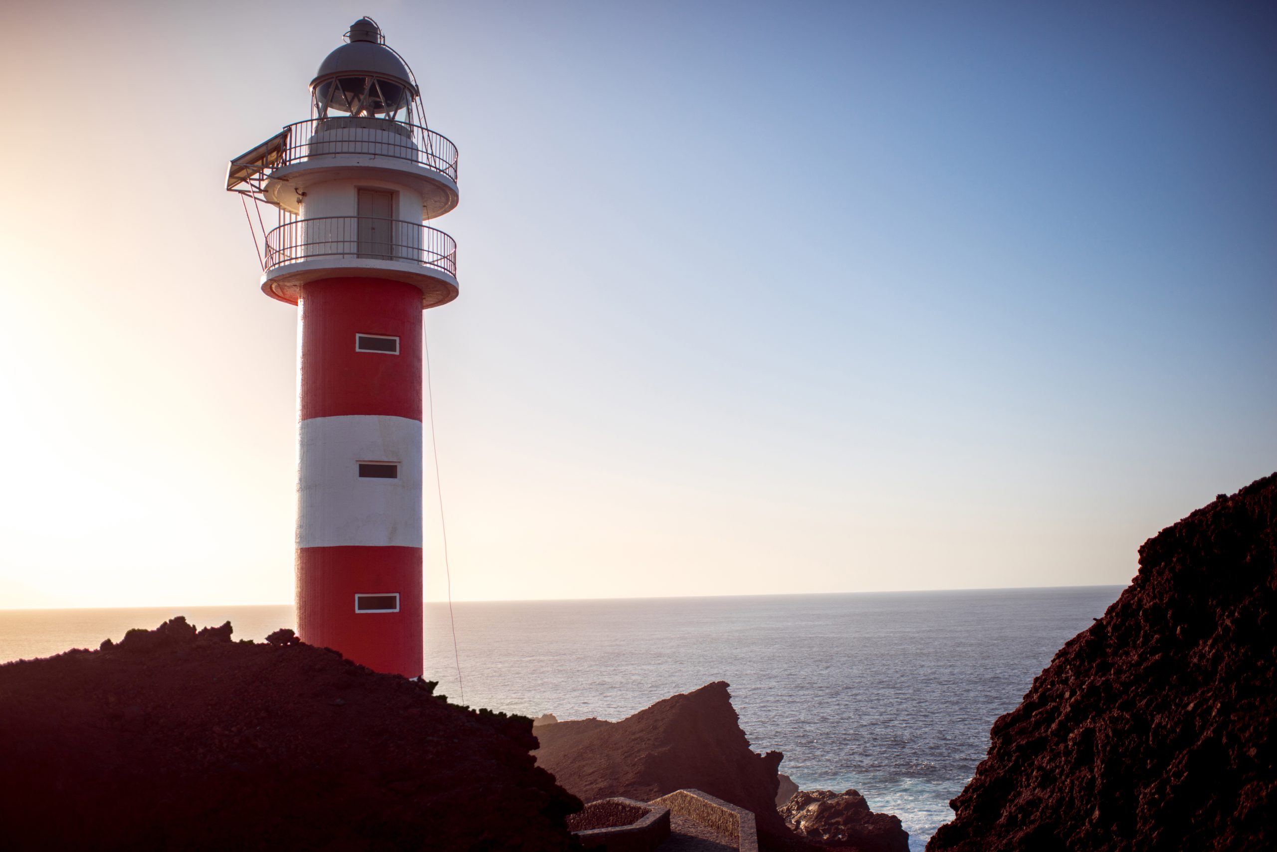 Lighthouse on the cape Teno on Tenerife island in Spain at sunset
